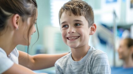 Fototapeta premium Physical Therapy Triumph: Capture the scene in a physical therapy session where the young boy beams with pride while looking at his muscle, encouraged by the female therapist. 