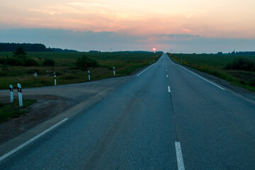 Fototapeta premium an asphalt road leading to the horizon