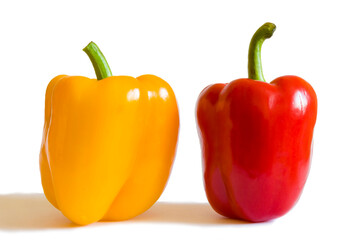 Red and yellow peppers on a white background.

