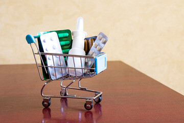 A small cart with medications on the table. Purchasing medications.
