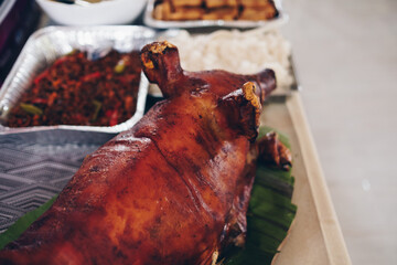 Closeup and back view of the popular, delicious and crispy roasted pig or pork known as 