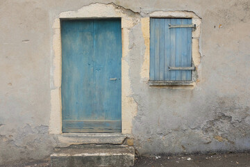 Weathered Blue Door and Shuttered Window, Cracked Stone Wall, Southern France