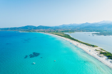 Obraz premium Aerial view on beach and mountains. Vacation and adventure. Italy, Mediterranean Sea. Top view from drone at beach and azure sea. View on the coast from drone.