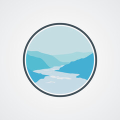 Landscape overlooking a mountain lake with silhouettes of mountains, lake, river and pine forest at sunrise or sunset.