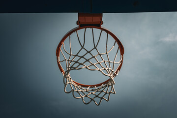 Basketball hoop. Low angle view. Outdoor street ball court.