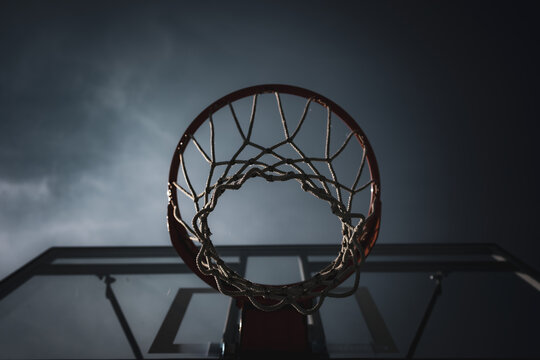 Street ball basketball hoop on a bad weather day. Negative concept.