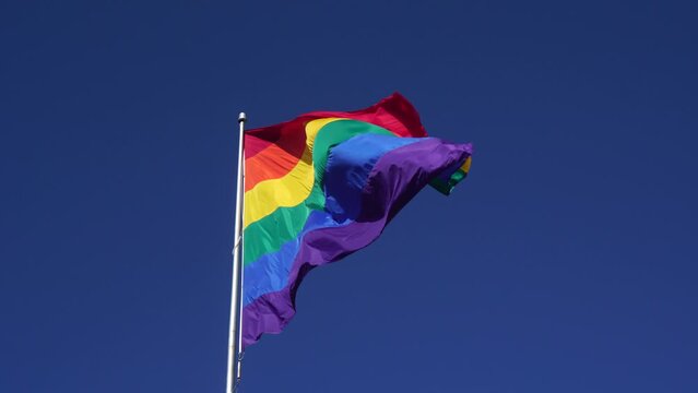 Handheld footage - Waving LGBT pride flag or Rainbow pride flag - Footage from Castro District, San Francisco Californian - include of Lesbian, gay, bisexual, and transgender flag of LGBT organization