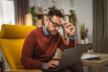 Adult exhausted man man work from home and have dilemma about work