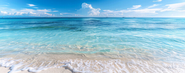 Beach background with a pristine, white sandy beach and crystal clear water.