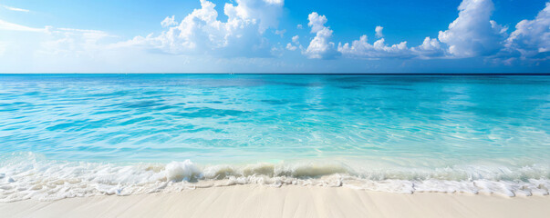 Beach background with a pristine, white sandy beach and crystal clear water.