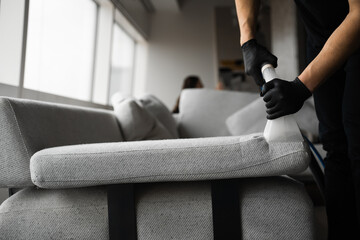 Dry-cleaning the upholstery furniture fibers with extractor. Extractor cleaning removes dust from...