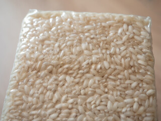 Packaging of rice for making risotto. Vacuum packed to preserve the quality of rice grains. A modern way to store cereals. Rectangular packaging for placing inside a cardboard box.