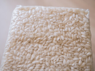 Packaging of rice for making risotto. Vacuum packed to preserve the quality of rice grains. A modern way to store cereals. Rectangular packaging for placing inside a cardboard box.