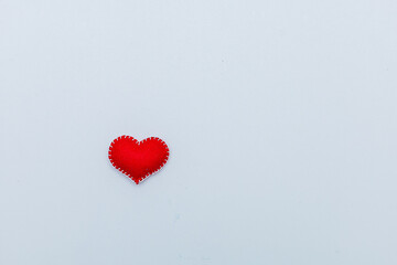 Felt red heart isolated on a white background