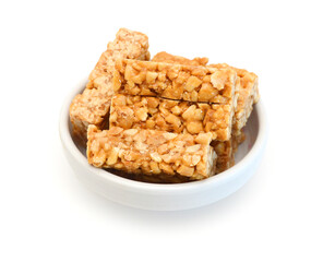 Honey bars with peanuts on white background
