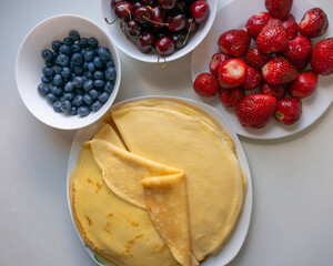 Fresh berries with pancakes or crepes for breakfast.