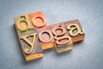 do yoga - motivational text in retro letterpress wood type stained by color ink, health, recreation...