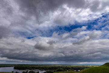 The sky is cloudy and the sun is not visible