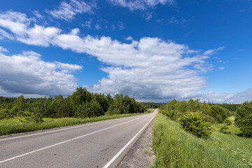 A road with a clear blue sky above it