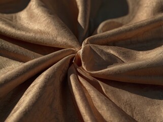 Folded fabric with silk and linen texture in warm and brown tones with copy space