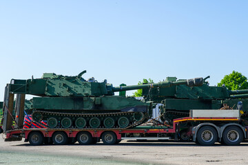 Transportation self propelled howitzer on public roads using heavy duty multi axle truck trailers