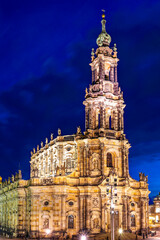 Night shot of the brightly lit Sanctissimae Trinitatis Cathedral in the old town of Dresden.