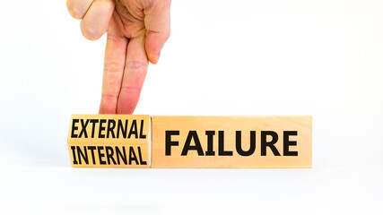 External or internal failure symbol. Concept words External failure or Internal failure on blocks. Beautiful white background. Businessman hand. Business external internal failure concept. Copy space