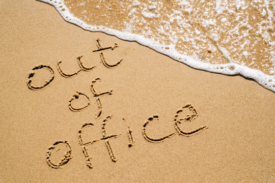 Out of Office Inscription in the Sand