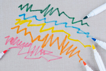 Marks felt tip pen in fabric sofa. Kid's bright scribble on a upholstery background. top view....