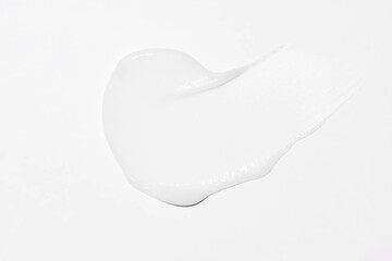 Face cream stroke isolated on white background. White exfoliation cream smear smudge sample. face...