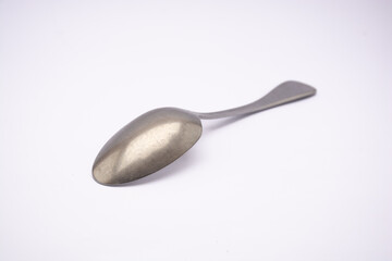 plain tablespoon made of stainless steel isolated on white