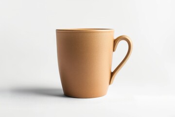 Obraz premium A Single Tan Mug Stands Tall Against a Pristine White Background