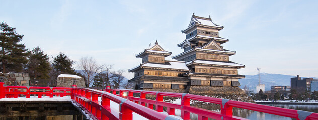 old castle in japan. Matsumoto castle against blue sky in Nagono city, Japan. Castle in Winter. Travel Matsumoto Castle with frozen pond in Winter. A Japanese premier historic castles