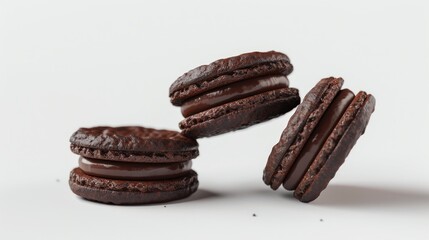 A stack of chocolate cookies on a white surface