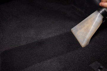 Use a professional vacuum extraction tool for comprehensive car carpet cleaning