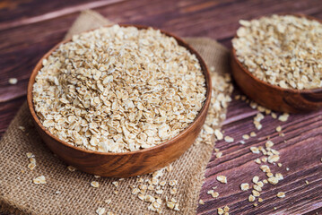 Oats in wooden bowl . Healthy food