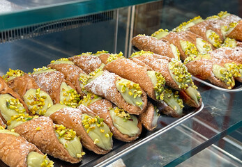 Cannoli with pistachio in  traditional Italian bakery