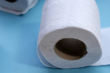 Toilet paper on blue background.