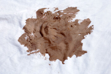 Dirty stain chocolate ice cream  on white clothes