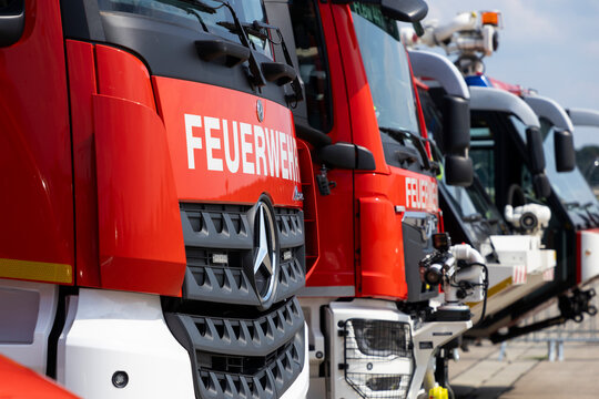 Fire brigade emergency response vehicles parked in a row