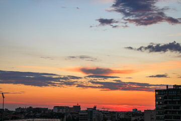 Cityscape of Novi Sad with urban skyline under sunset sky in evening