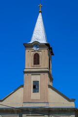 Obraz premium Catholic church tower in a small town in Vojvodina Backa Palanka