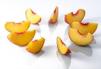 Peach isolated. Whole peach with a slice on white background. Peach fruit with leaf and cut pieces. Full depth of field. 1