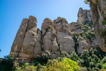 Close view of imposing monolithic rocks seen from the path that leads to Santa Cova on the...