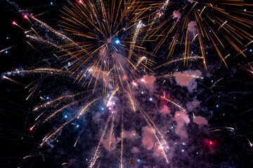 Fototapeta premium Beautiful fireworks at night. Selective focus. 