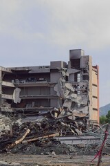 Fototapeta premium Apartment building destroyed by fire and being torn down.