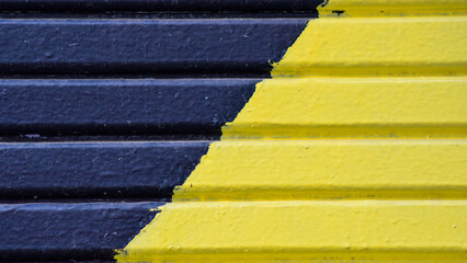 Striped wall painted yellow and blue
