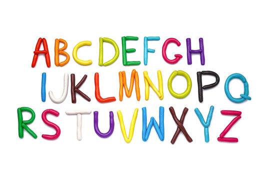 Colorful letters of English alphabet made of play dough on white background
