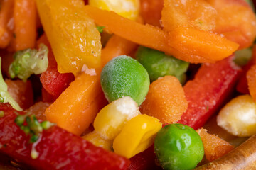 a mixture of quick-frozen corn, peas, peppers, and carrots