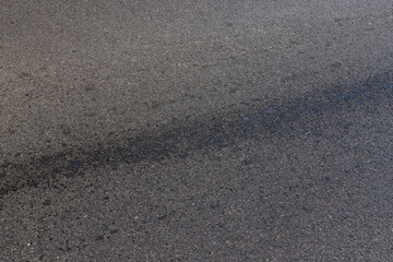 white road markings on asphalt, close up